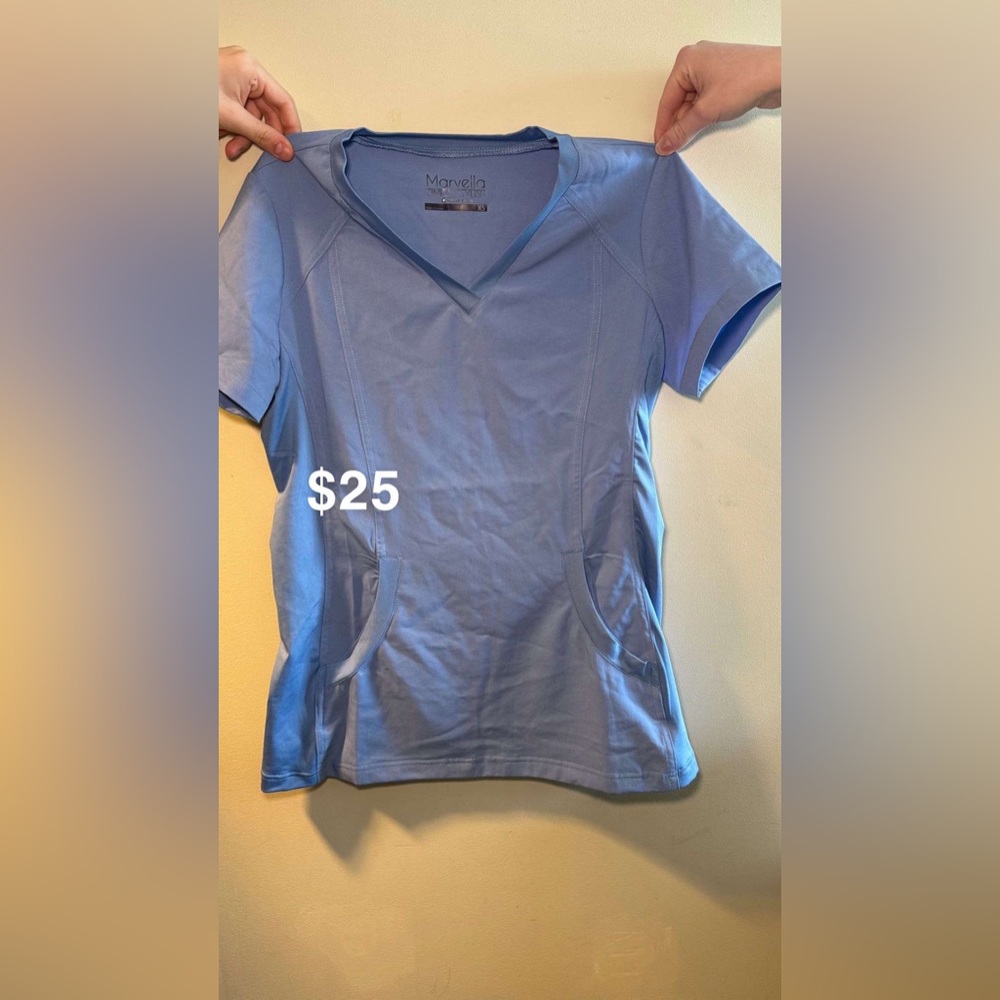 Marvella scrubs in a light blue